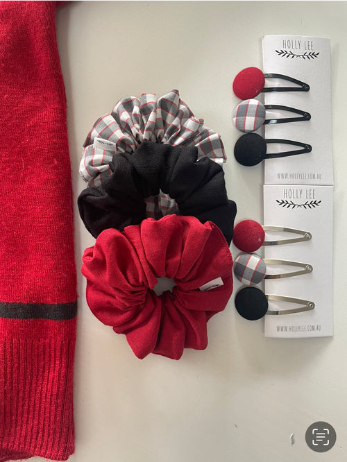 Red, black and grey check scrunchies pictured beside coordinating snap hair clips
